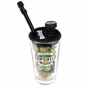 Marshmallow Mountain THCa Hemp Flower in a glass container with a dab tool.